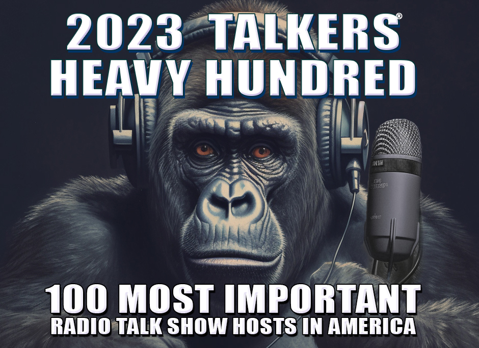 Gorilla talking into a microphone while wearing headphones as the Heaviest of the Hundred.