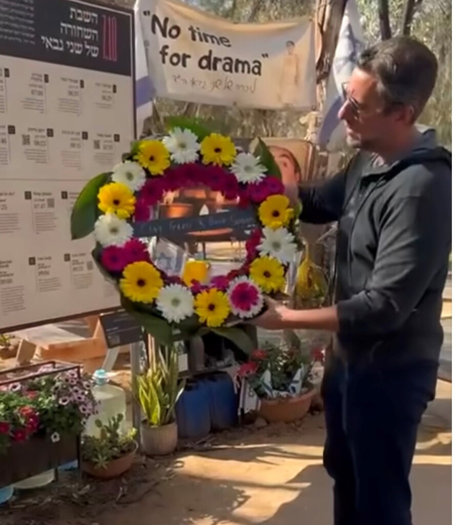 Clay Travis pays his respects at the Nova Music Festival Memorial where he laid a wreath. 